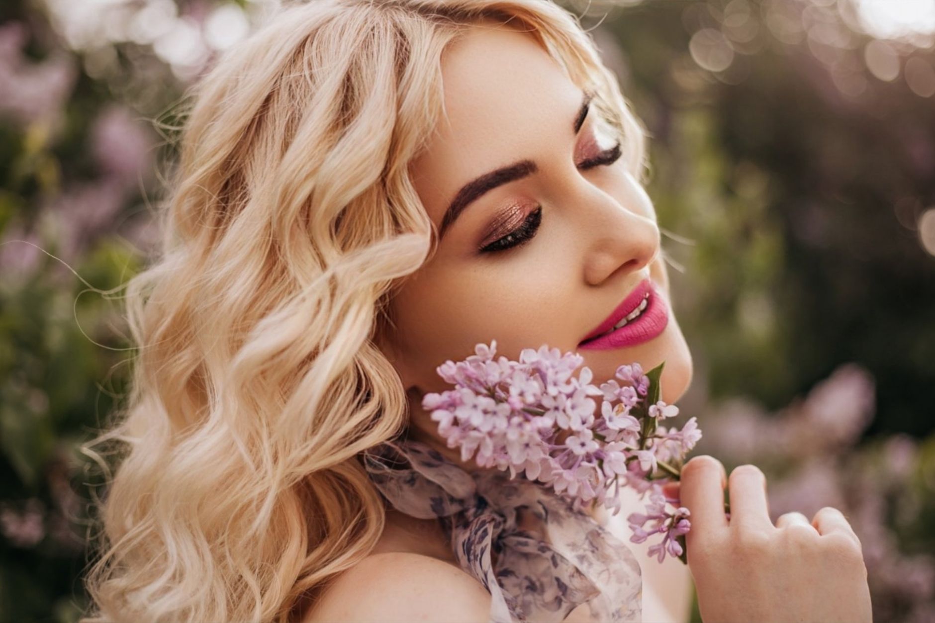 Smiling blonde woman with flowers enjoying spring outdoors, highlighting beauty and floral elegance. — The Importance of Regu